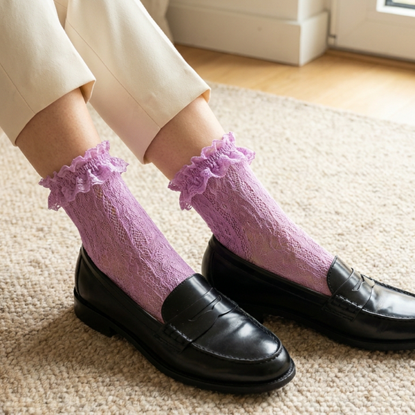 Lavender lace ankle socks with black penny loafers and cropped cream trousers.